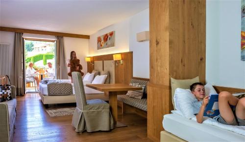 Ένα ή περισσότερα κρεβάτια σε δωμάτιο στο Rio Stava Family Resort & Spa