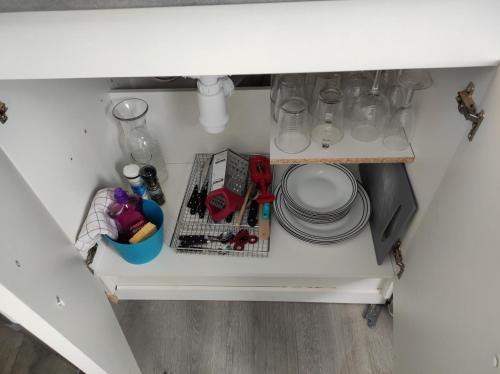 an overhead view of a kitchen drawer with utensils at 16 rue des Déportés in Charmes