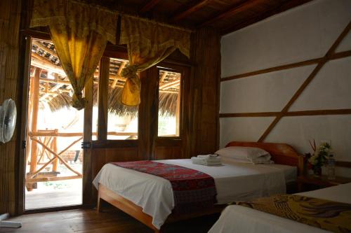Кровать или кровати в номере Hostal Rutamar
