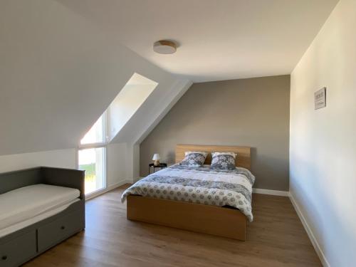 a bedroom with a bed and a window at Jolie maison avec SPA à la campagne ! 