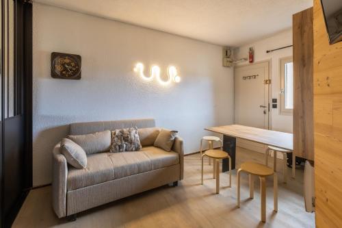 Posezení v ubytování Jeanne - Appartement Vue Lac et Montagnes