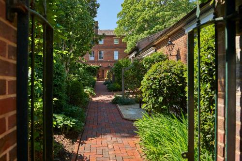 an entrance to a garden with a brick walkway at Hotel du Vin Winchester in Winchester