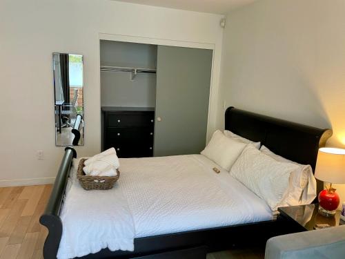 a bedroom with a bed with a basket on it at Hollywood’s Suite in Los Angeles