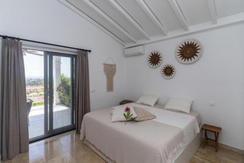 Postel nebo postele na pokoji v ubytování Casa Pura Vida