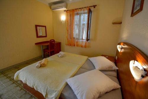 Postel nebo postele na pokoji v ubytování Bungalow Olivtree