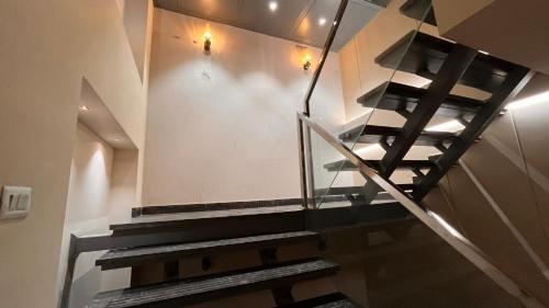 a staircase in a building with black and white at IP Royal Hotel - New Delhi in New Delhi