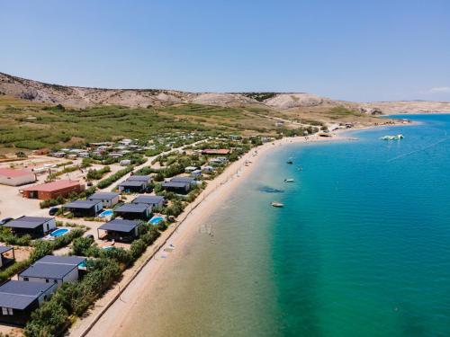 an aerial view of a beach with houses and the ocean at Terra Park SpiritoS in Kolan