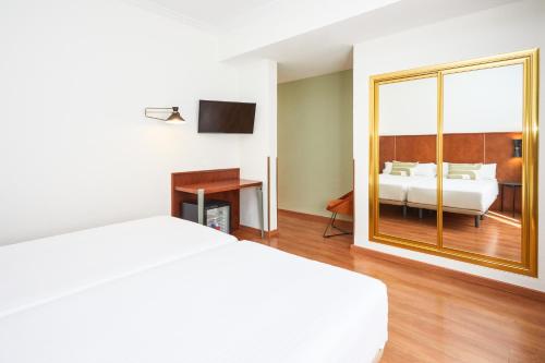 Кровать или кровати в номере Hotel Casón del Tormes by HappyCulture