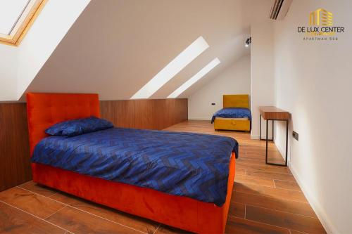 Postel nebo postele na pokoji v ubytování DeLux Center Apartments Inđija
