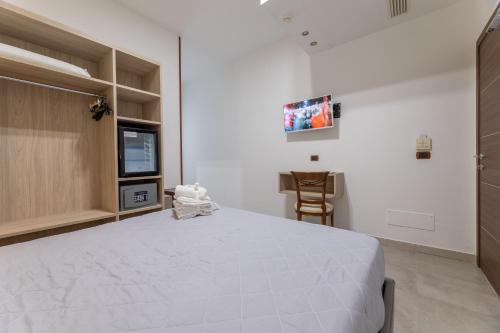 Ένα ή περισσότερα κρεβάτια σε δωμάτιο στο Hotel Salento Mirfran
