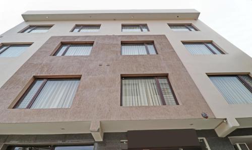 a tall brick building with windows at Treebo Magnum Chandigarh in Mohali