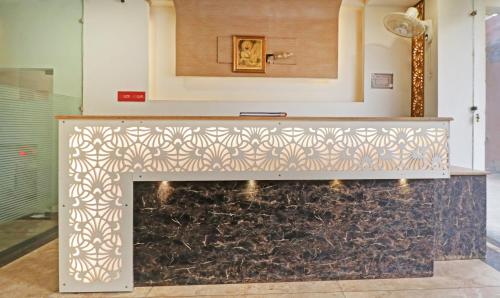 a fireplace in a living room with a wall at Treebo Magnum Chandigarh in Mohali