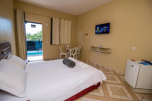 Ένα ή περισσότερα κρεβάτια σε δωμάτιο στο Hotel Flor de Lótus II