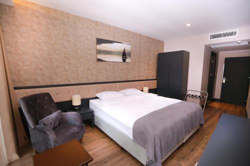 מיטה או מיטות בחדר ב-PENTAHOR HOTEL