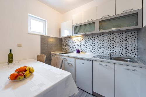 Η κουζίνα ή μικρή κουζίνα στο Apartment Fiorenini