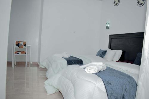 Katil atau katil-katil dalam bilik di INZOZI AFRICA HOUSE B&B-Gishushu