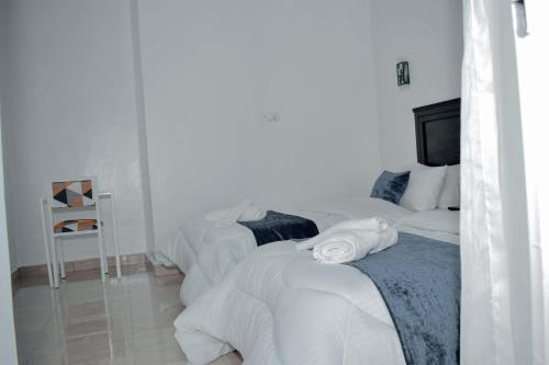 Katil atau katil-katil dalam bilik di INZOZI AFRICA HOUSE B&B-Gishushu