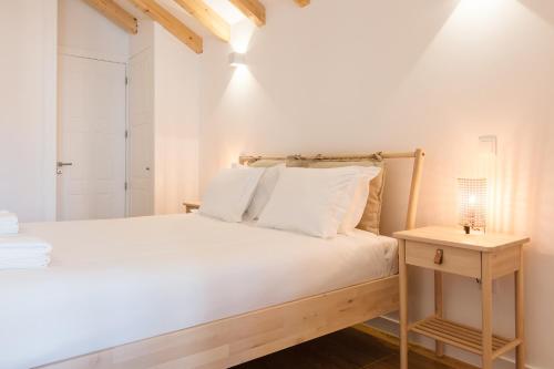 Ένα ή περισσότερα κρεβάτια σε δωμάτιο στο ORM Prado Apartment