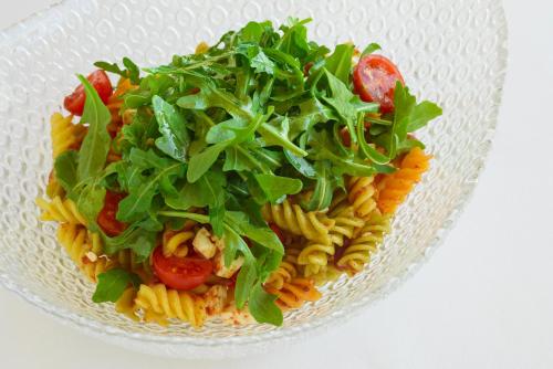 a glass bowl of pasta with lettuce and tomatoes at Torre del Marqués Hotel Spa & Winery - Small Luxury Hotels in Monroyo
