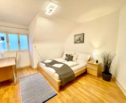 Кровать или кровати в номере Zentrales Apartment Pfänderblick