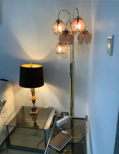 a glass table with a lamp on top of it at Cozy studio close to Zaventem Airport in Brussels