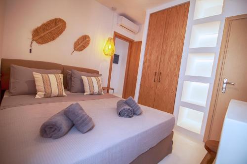 A bed or beds in a room at Villa Piccolo Mondo with private pool and sea view