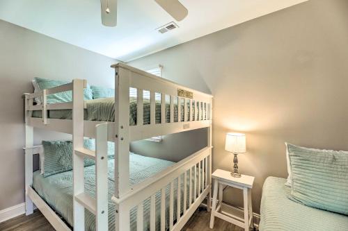 a room with two bunk beds and a bed at Emerald Isle Escape with Bikes about 1 Mi to Beach! in Emerald Isle