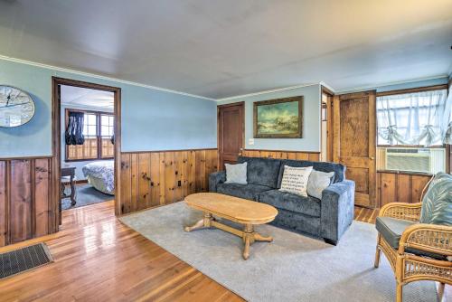 a living room with a couch and a table at Point Pleasant Abode with Lagoon and Boat Dock! in Point Pleasant
