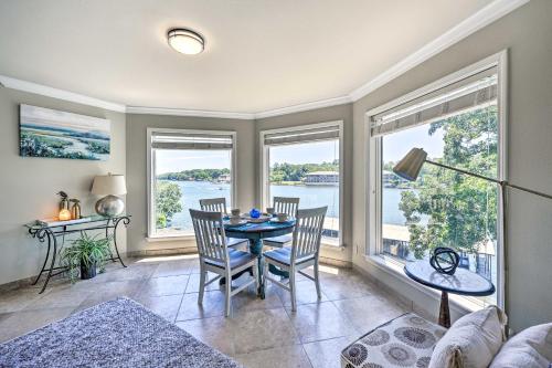 a living room with a table and chairs and windows at Lakeview Blue Oasis in Hot Springs Lake Access in Hot Springs