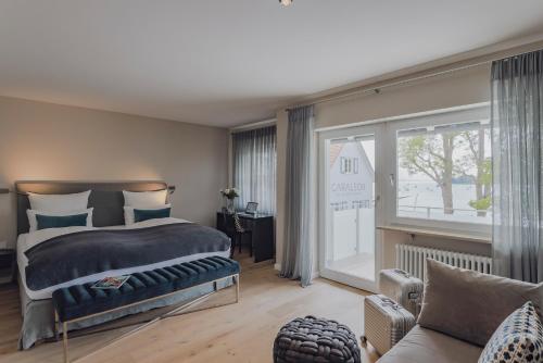Postel nebo postele na pokoji v ubytování Hotel Caraleon