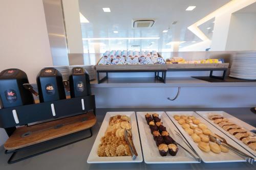 a bakery with many different types of pastries on display at Hotel Delle Nazioni - Adults Only in Caorle