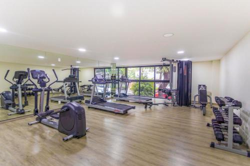 a gym with treadmills and machines in a room at Del Valle Luxury Apartment in Mexico City