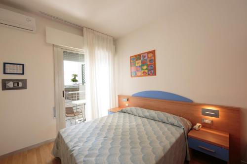 Кровать или кровати в номере Hotel Riviera