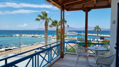 a balcony with a view of the ocean and a beach at Hotel Alexandra in Skala