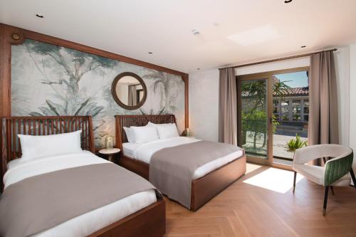 Postel nebo postele na pokoji v ubytování Genesis Hotel&Spa Alaçatı