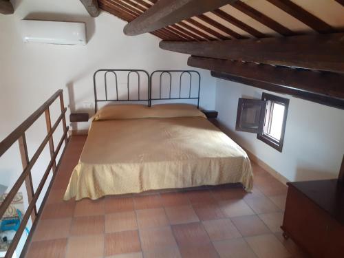 a bedroom with a bed in a room at La Casa di Cofano in Custonaci