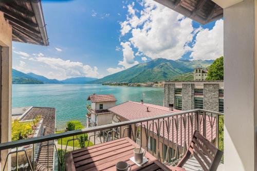 a view of a lake from a balcony at Stunning view lakeside apartment - Larihome A11 in Gravedona