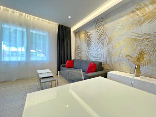 a living room with a couch and a table at Arcioun Suite in Riccione