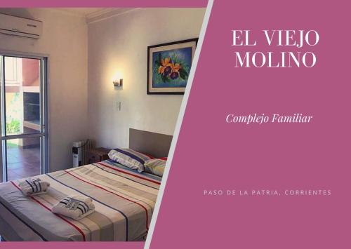 a poster of a bedroom with a bed and a window at Complejo Familiar EL VIEJO MOLINO in Paso de la Patria