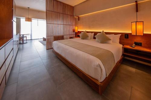 Ένα ή περισσότερα κρεβάτια σε δωμάτιο στο Hive Cancun by G Hotels