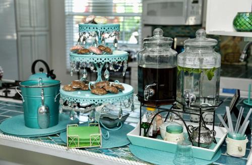 a counter with two plates of food in glass jars at Inn on the Avenue in New Smyrna Beach