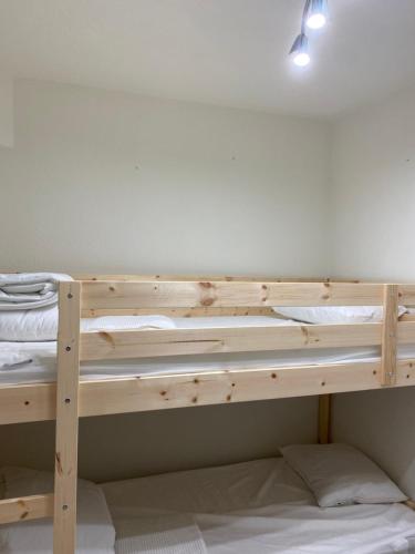a wooden bunk bed in a room at Maria Luísa in Olhos de Água