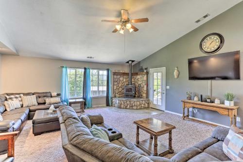 a large living room with a couch and a tv at Private Pool and Game Room Family Weaverville Gem in Weaverville