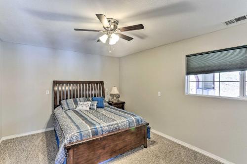 a bedroom with a bed and a ceiling fan at Private Pool and Game Room Family Weaverville Gem in Weaverville
