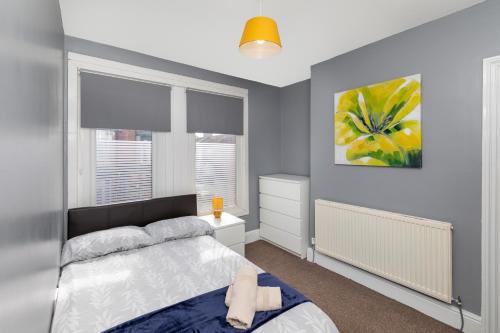 a bedroom with a bed and a window at Middlesbrough Town Centre Double Private Rooms in Middlesbrough