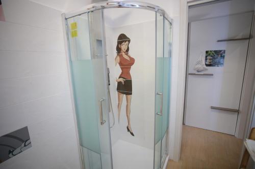 a painting of a woman in a glass elevator at DON VINCENZO APARTMENT in Gragnano