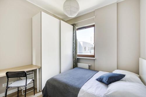Llit o llits en una habitació de MG Apartments Giełdowa