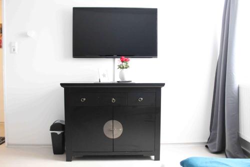 Televisyen dan/atau pusat hiburan di Marstall Apartmenthaus Kassel