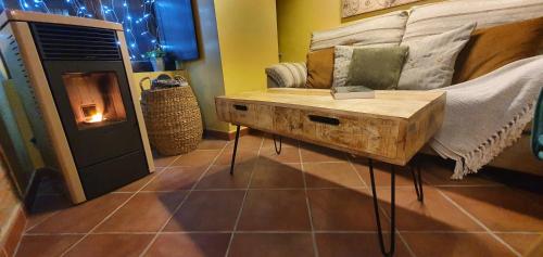 a living room with a couch and a table at Apartamento Rural Sefardí, Barrio Judío de Hervás in Hervás