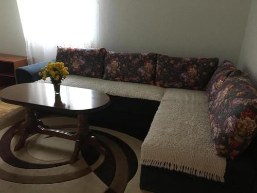 a living room with a couch and a table at Durmitor view in Žabljak